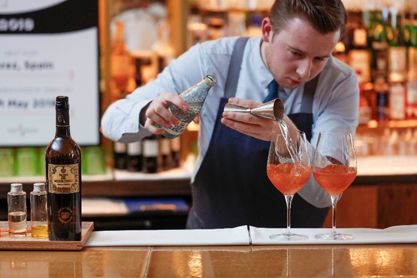 Bartender pouring cocktail